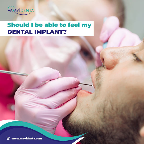 I can feel my dental implant through my gum